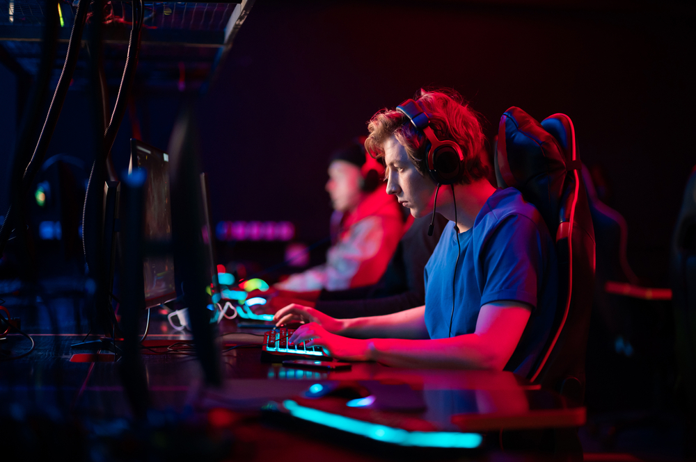 Professional esports players at an online game tournament. The cyber team plays computers and trains.