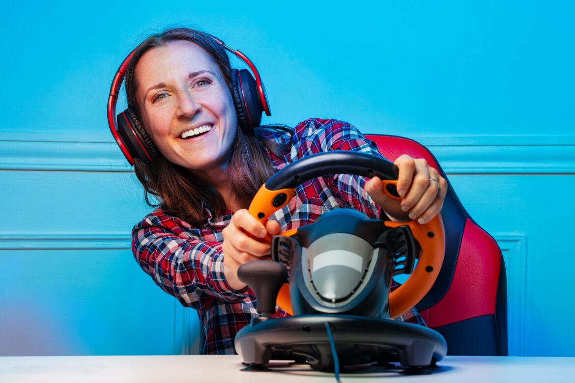 Women playing racing video game