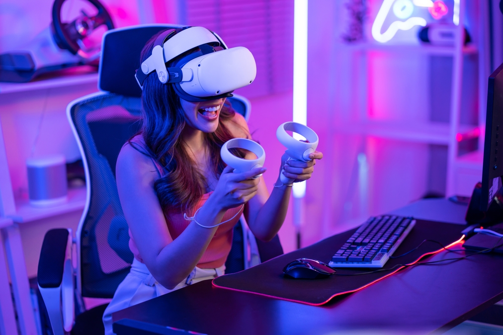 women playing games while wearing VR headset and controllers