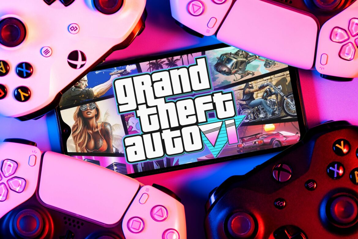 Smartphone with concept of GTA 6 logo on screen surrounded by gamepads representing the updates regarding GTA VI